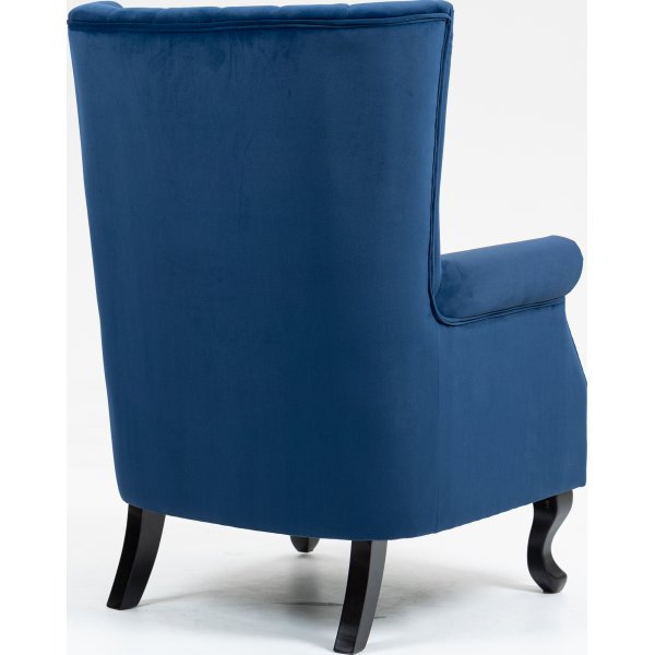 Blauer Ohrenklappensessel aus Samt Blauer Ohrenklappensessel aus Samt