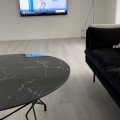 Kundenbild Couchtisch Star 90 cm - Schwarzes Marmorglas / schwarzer Sockel